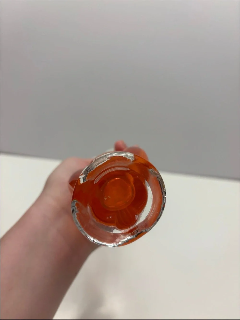 Vintage orange and clear glass swung bud vase